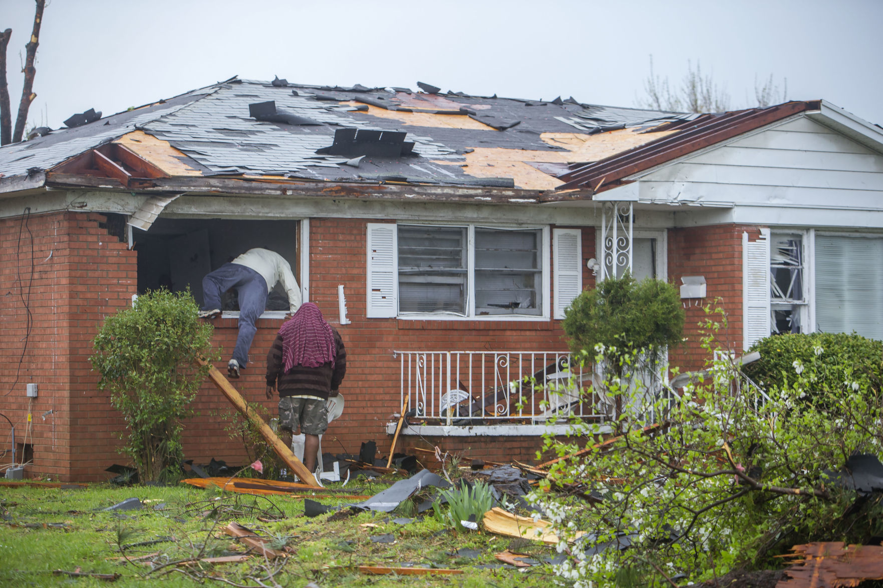 Tornado: Residents climb through window